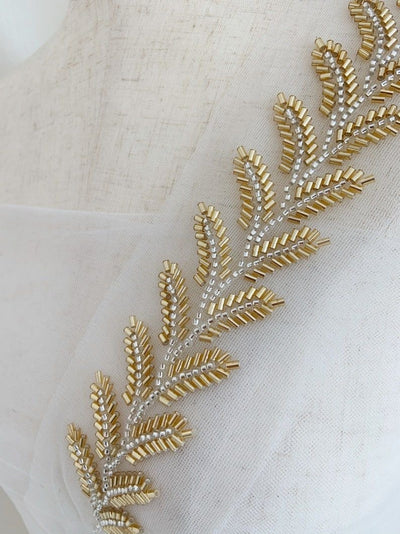 BeadworkUse of beads to create patterns and textures — adds dimension.