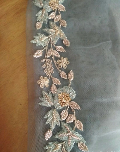 Zari WorkIntricate metallic thread embroidery, usually gold or silver — very traditional and festive.