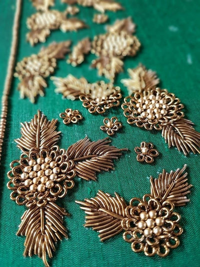 ZardoziHeavy gold/silver thread embroidery with beads, stones, and sequins — royal and bridal favorite.